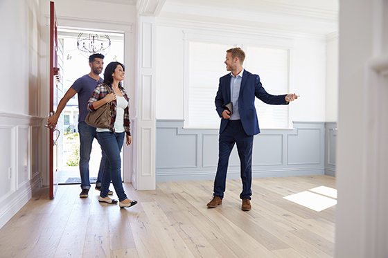 Agent showing a couple a newly built home