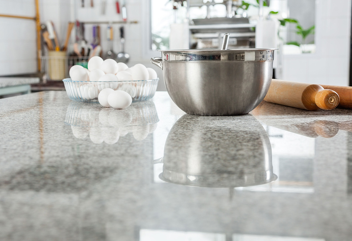 Kitchen counter with eggs, mixing bowl, and rolling pin